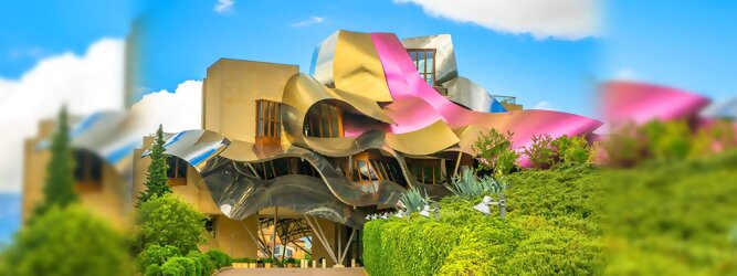 Trip Kanaren Reisetipps - Marqués de Riscal Design Hotel, Bilbao, Elciego, Spanien. Fantastisch galaktisch, unverkennbar ein Werk von Frank O. Gehry. Inmitten idyllischer Weinberge in der Rioja Region des Baskenlandes, bezaubert das schimmernde Bauobjekt mit einer Struktur bunter, edel glänzender verflochtener Metallbänder. Glanz im Baskenland - Es muss etwas ganz Besonderes sein. Emotional, zukunftsweisend, einzigartig. Denn in dieser Region, etwa 133 km südlich von Bilbao, sind Weingüter normalerweise nicht für die Öffentlichkeit zugänglich.